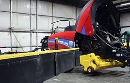 Farm equipment being serviced within the SS Equipment service facility.